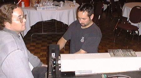Derek sets up the New Wave Lasers projector while Karl kibitzes.