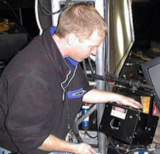 Laserist A.J. Seabeck installs a fiber optic remote