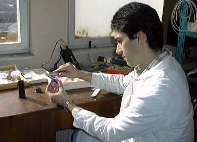 osef Elenkov checks the dimensions of a newly assembled high reflector
